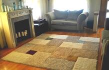 Karpet van diverse tapijttegels aan elkaar bevestigt dmv TacTiles